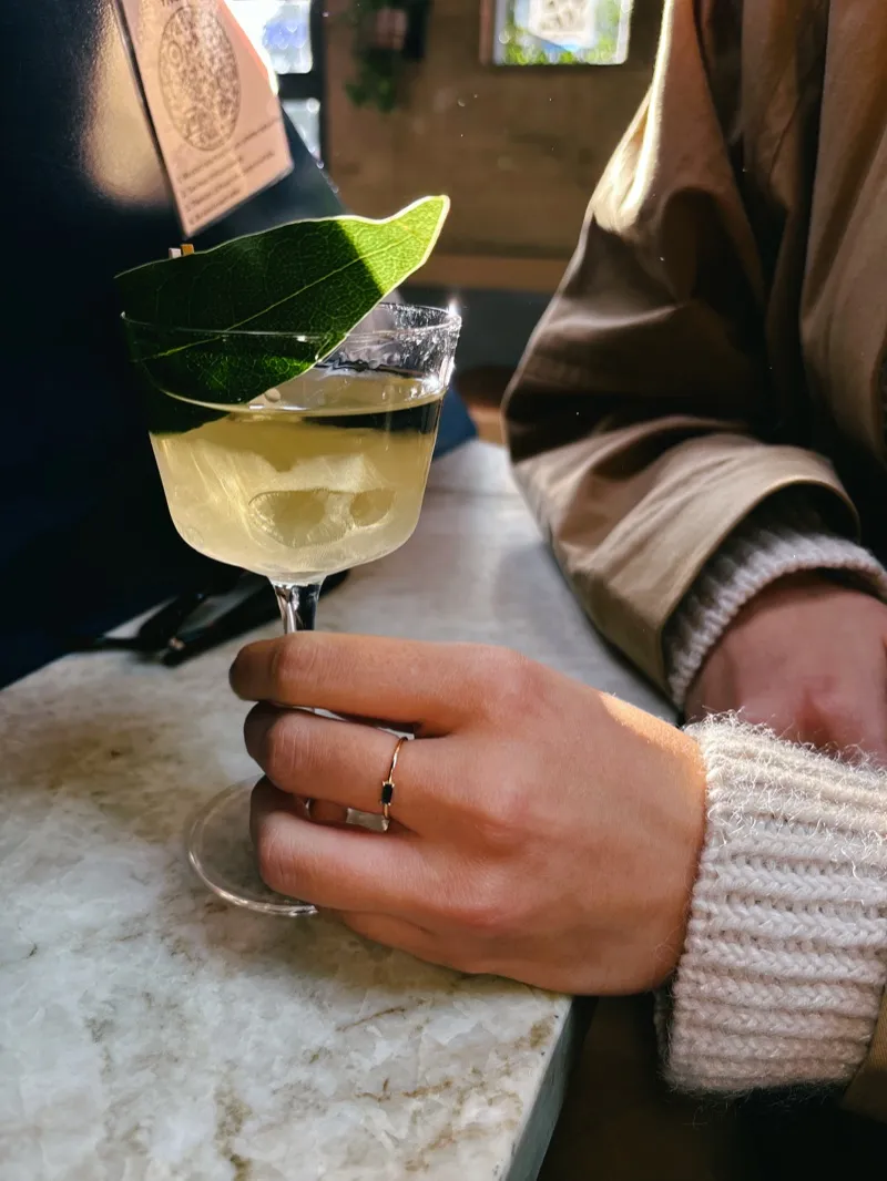 A cocktail on a marble bar